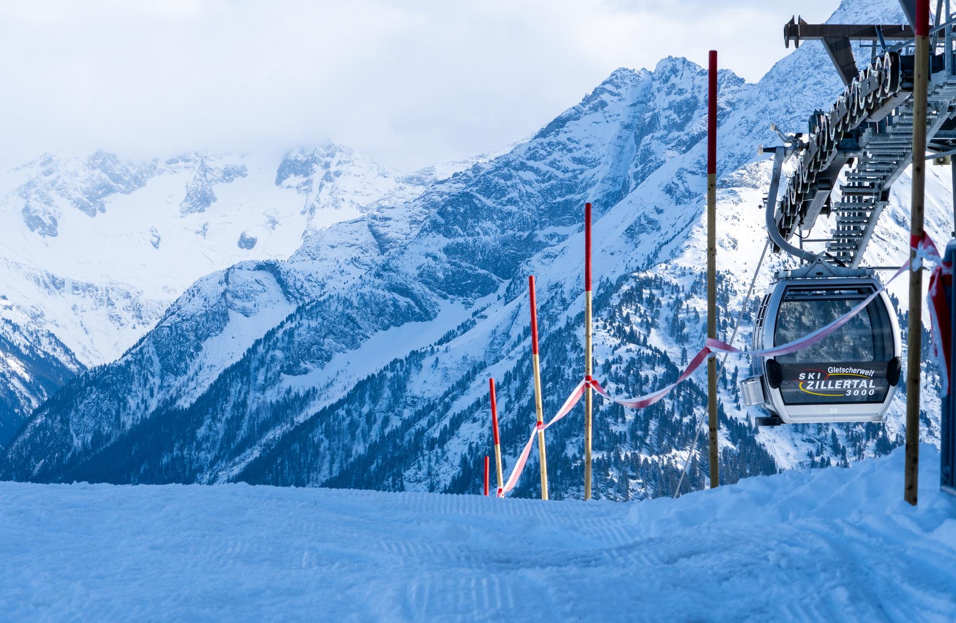 Gondola taking skiers to top of snowy mountain ski slope in Mayrhofen Austria